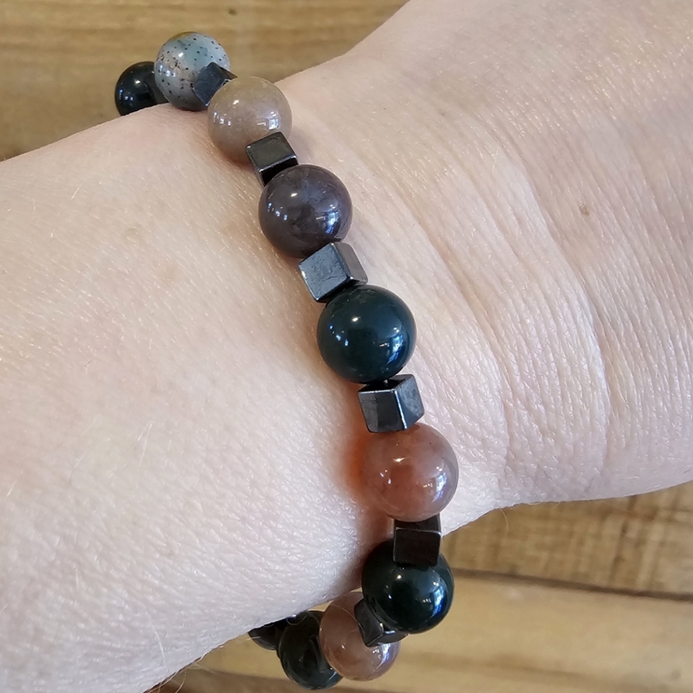 Polished gemstone bead bracelet with hemitate spacer beads